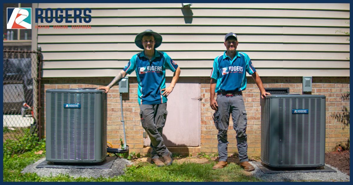 Rogers technicians by air conditioners